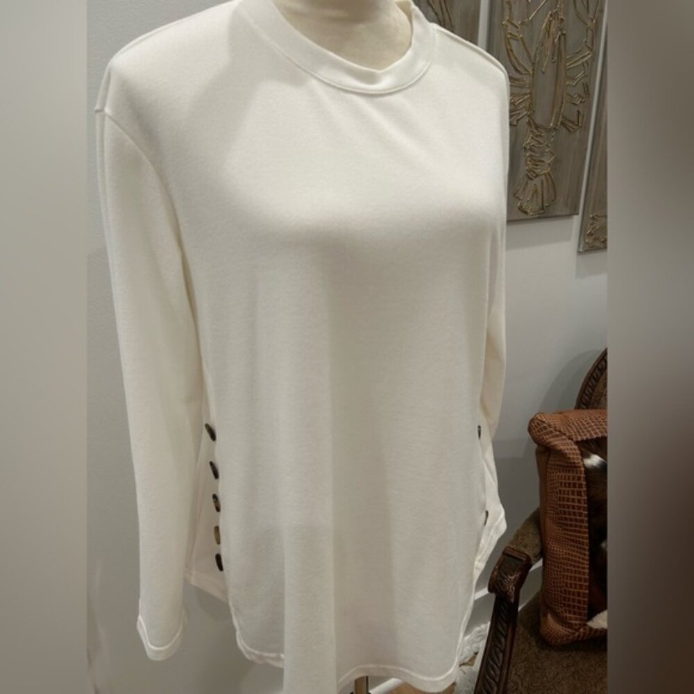 Beautiful cream, long sleeve tee with buttons on the side.